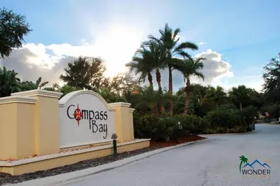 a sign for the entrance to the miami kiss bar at Four Bedrooms Townhome 5126 in Kissimmee