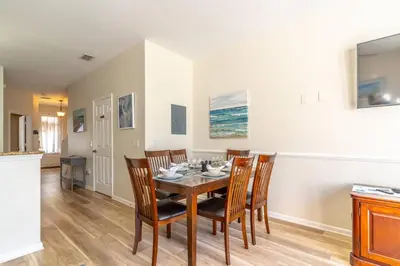 a dining room with a table and chairs at 2582 Windsor Hills in Orlando