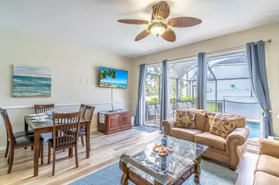 a living room with a couch and a table at 2582 Windsor Hills in Orlando