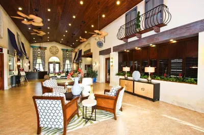 a lobby of a hotel with chairs and tables at 3085 Paradise Palms in Kissimmee