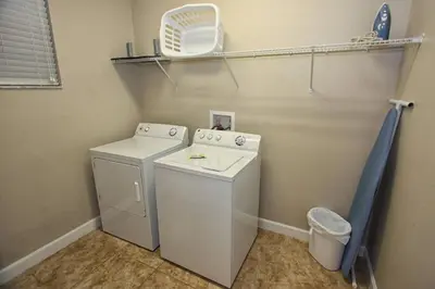 a laundry room with a washing machine and a washer at 8965 Paradise in Kissimmee