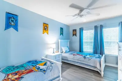 a bedroom with two beds and a ceiling fan at 3031 Encantada in Kissimmee