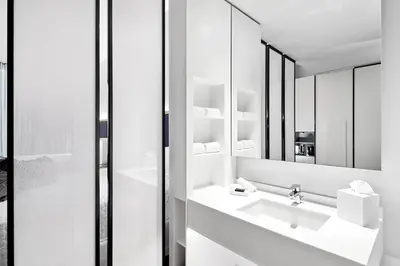 a bathroom with a sink and a mirror at Universal's Aventura Hotel in Orlando