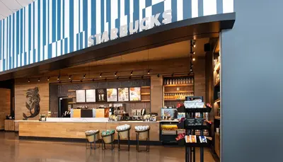 a store with bar stools in a shopping mall at Universal's Aventura Hotel in Orlando