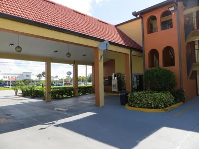 an empty parking lot outside of a building at Budget Inn Of Orlando in Orlando