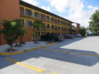 a parking lot in front of a hotel at Budget Inn Of Orlando in Orlando