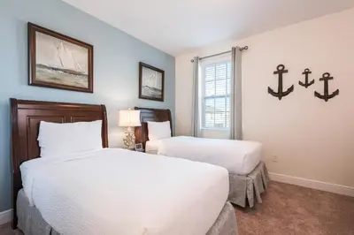 a bedroom with two beds and a window at Inviting Home With Private Pool Near Disney With Water Park & Resort Access At Encore Resort - 7498Mr in Kissimmee