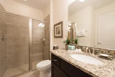 a bathroom with a shower and a sink and a toilet at Inviting Home With Private Pool Near Disney With Water Park & Resort Access At Encore Resort - 7498Mr in Kissimmee