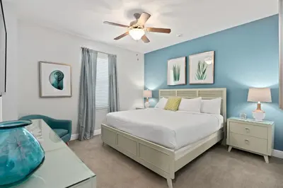 a bedroom with a bed and a ceiling fan at Beautiful Home With Private Pool, Media & Game Room Near Disney With Waterpark And Resort Access At Encore Resorts Reunion - 210Cl in Kissimmee