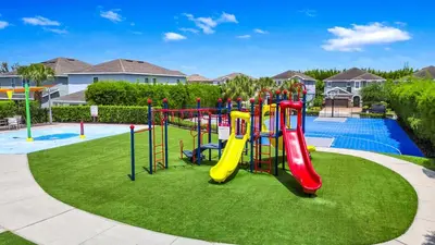 a playground with a slide in a park at Glorious Home Near Disney With Private Pool, Media Room And Waterpark & Resort Access At Encore Resorts Reunion - 741La in Orlando