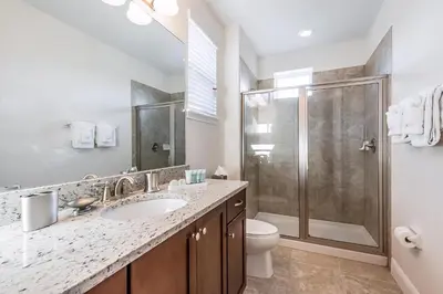 a bathroom with a sink and a shower at Elegant Home Near Disney With Private Pool And Waterpark & Resort Access At Encore Resorts Reunion - 391Fl in Kissimmee