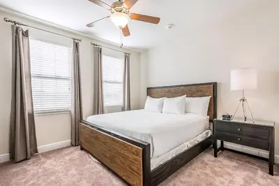 a bedroom with a bed and a ceiling fan at Elegant Home Near Disney With Private Pool And Waterpark & Resort Access At Encore Resorts Reunion - 391Fl in Kissimmee