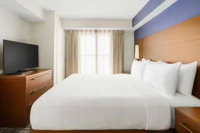 a hotel room with a large bed and a television at Residence Inn Orlando Lake Buena Vista in Orlando