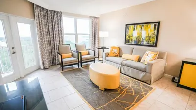 a living room with a couch and a table at Vacation Village Orlando, Celebration in Orlando