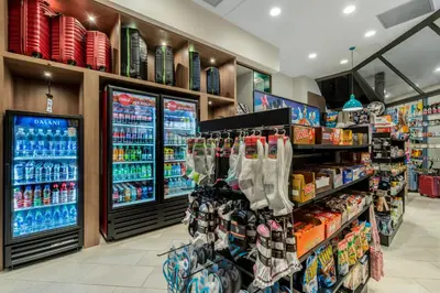 a store aisle with a display of bottled drinks at Holiday Inn Orlando International Dr-ICON by IHG in Orlando