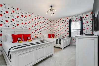 two beds in a bedroom with hearts on the wall at Veranda Palms 8 Bedroom Home with Pool 1722 in Kissimmee