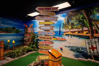 a mural of a resort with signs on the wall at Coco Key Hotel & Water Park Resort in Orlando