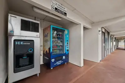 a vending machine in a building with a drink cooler at Americas Best Value Inn Orlando, FL in Orlando