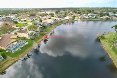 an aerial view of a river with a red arrow at Mickey's Lake Villa in Orlando