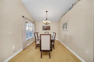 a dining room with a table and chairs at Indian Creek 3.5 miles from Disney in Orlando