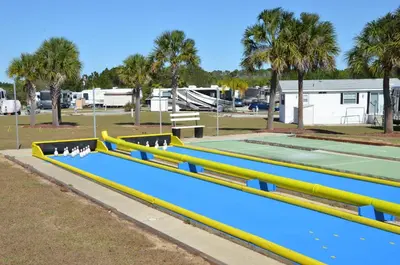a row of yellow and blue tennis courts at Orlando RV Resort in Orlando