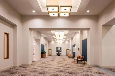 an empty hallway in a hospital lobby with chairs at The Westin Lake Mary, Orlando North in Lake Mary