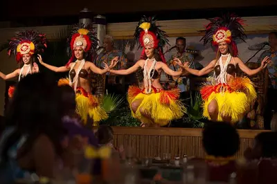 a group of people performing a performance on a stage at Universal's Loews Royal Pacific Resort in Orlando