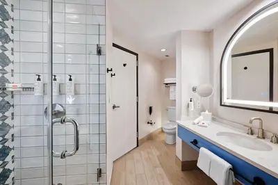a bathroom with a sink and a shower at Universal's Hard Rock Hotel® in Orlando