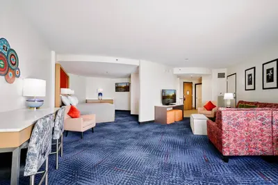a living room with a couch and a living room with a couch at Universal's Hard Rock Hotel® in Orlando