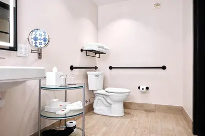 a bathroom with a toilet and a sink at Universal's Hard Rock Hotel® in Orlando