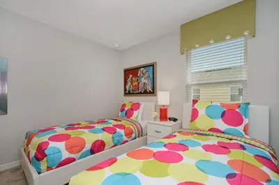a bedroom with two beds and a window at Four Bedrooms Townhouse 5102 in Kissimmee