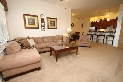 a living room with a couch and a table at Shoreway House #231533 in Orlando