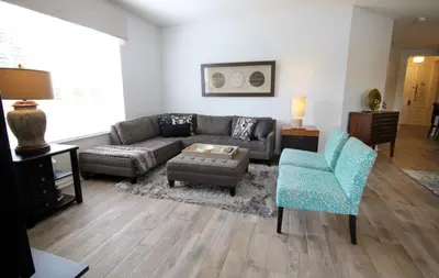 a living room with a couch and a chair at Cayview Condo #231537 in Orlando