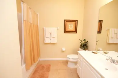 a bathroom with a toilet and a sink at Cayview House #231539 in Orlando