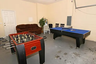 a room with a ping pong table at Morningstar Villa #230785 in Orlando