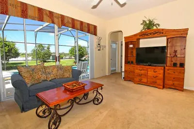 a living room with a couch and a coffee table at Morningstar Villa #230785 in Orlando