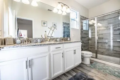 a white bathroom with a shower and a toilet at King Castle Villa #230920 in Kissimmee