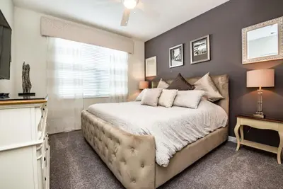a bedroom with a large bed and a window at King Castle Villa #230920 in Kissimmee