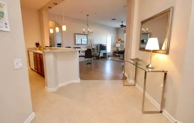 a living room with a kitchen and a dining room at CayView Condo #231544 in Orlando