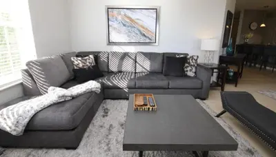 a living room with a couch and a coffee table at Cayview Condo #231541 in Orlando