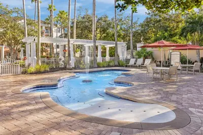 a pool with a fountain in the middle of a patio at Marriott's Grande Vista in Orlando