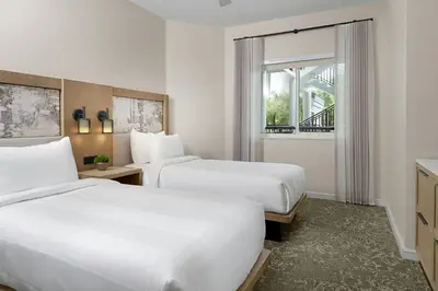 a hotel room with two beds and a window at Marriott's Imperial Palms Villas in Orlando