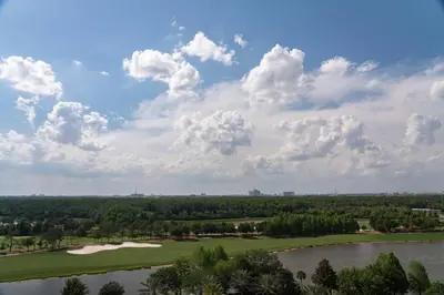 an aerial view of a golf course and a lake at The Ritz-Carlton Orlando, Grande Lakes in Orlando