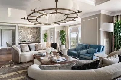 a living room with a couch and a chandelier at The Ritz-Carlton Orlando, Grande Lakes in Orlando