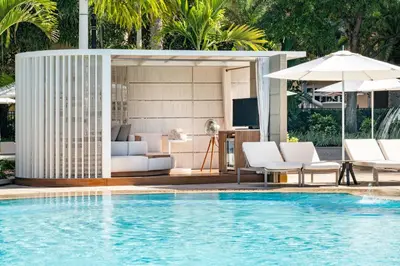 a swimming pool with a living room and a villa at The Ritz-Carlton Orlando, Grande Lakes in Orlando