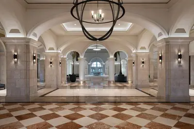 a large lobby with a chandelier and a checkered floor at JW Marriott Orlando Grande Lakes in Orlando
