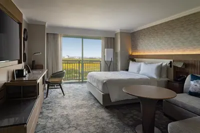 a hotel room with a bed and a television at JW Marriott Orlando Grande Lakes in Orlando