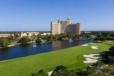 a golf course with a view of the city at JW Marriott Orlando Grande Lakes in Orlando