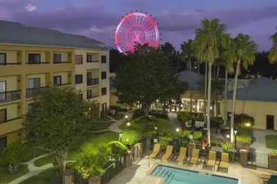 a view of a hotel with a ferris wheel in the background at Courtyard Orlando International Drive/Convention Center in Orlando