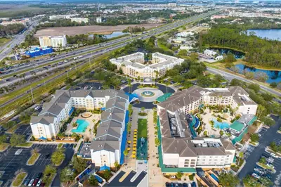 an aerial view of a resort with a pool and buildings at Courtyard by Marriott Orlando Lake Buena Vista in the Marriott Village in Orlando